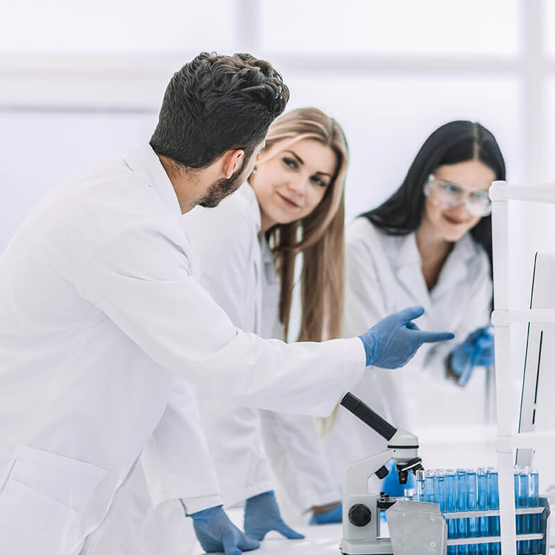Laboratory team reviewing cell therapy validation results