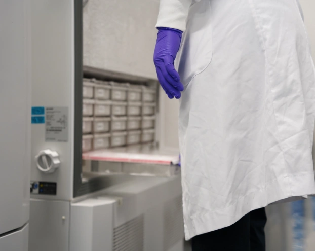 Laboratory technician accessing ultra-low-temperature clinical sample storage